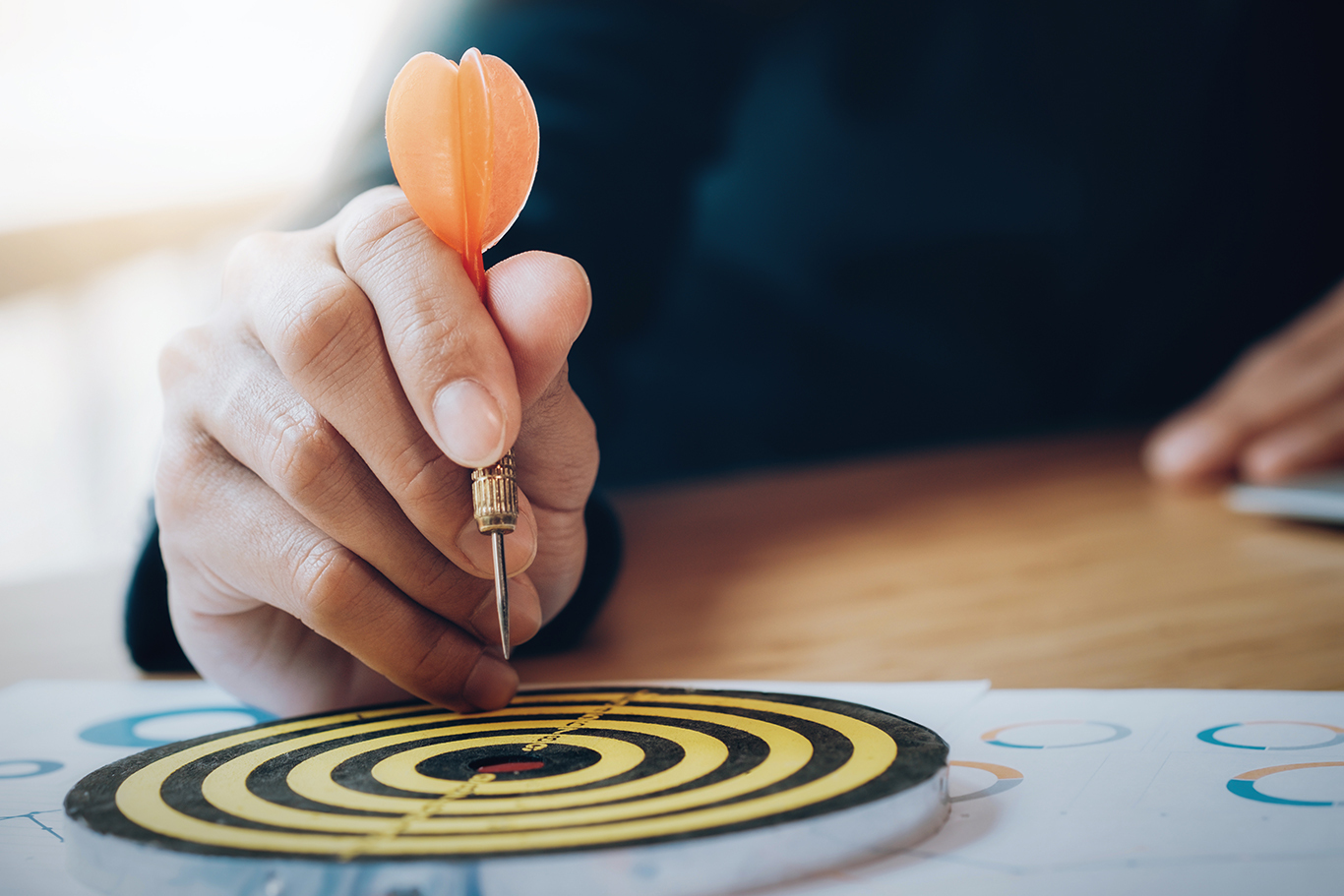 Business strategy planning success target goals. Businessman holding red dart push on target. Business strategy planning success target goals. Business development concept
